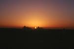 Desert sunrise with 2 vehicles